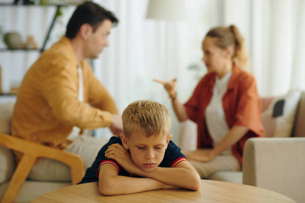 istock Sad Child Involving In His Parents Conflict 2159339617