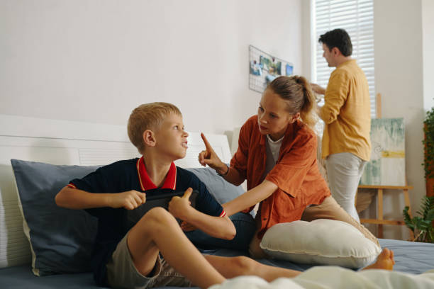 istock Mom Forbidding Her Son To Play On The Tablet 2159339720