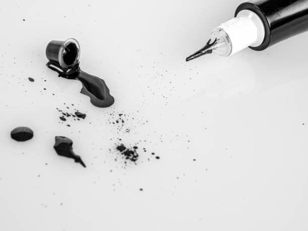 istock Tattoo machine for tattooing , permanent makeup, with jars of paint, close-up needle, selective focus 2159341846