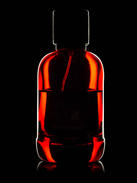 istock Bottle with perfume, eau de toilette, isolated on black background, close-up 2159342340