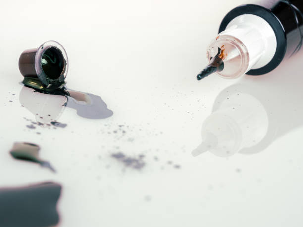istock Tattoo machine for tattooing , permanent makeup, with jars of paint, close-up needle 2159342922