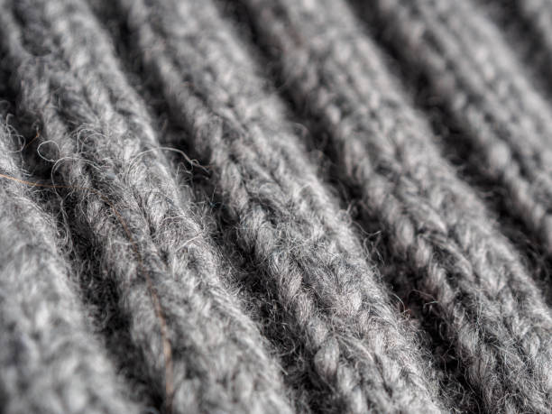 istock coarse knitted wool fabric, fabric background, close-up 2159343011