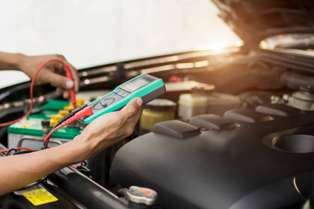 istock Auto mechanic Check batteries, repair, and replace engine parts. 2159343994
