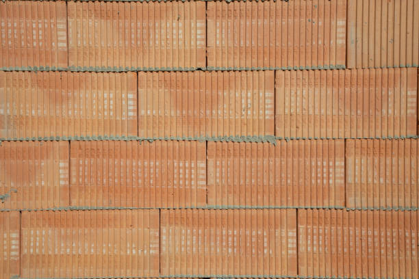 background of red hollow block stones at the constgruction site as industry background