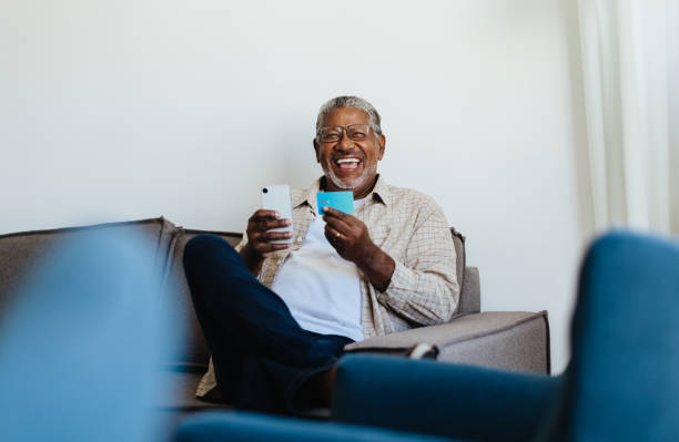 istock Technology Adoption: Confident senior man shopping online 2159347939