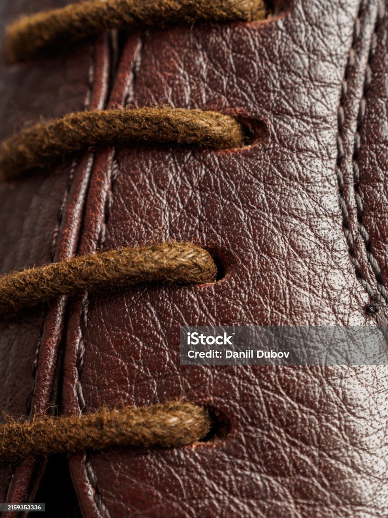 Laces on modern leather classic boots, macro shot selective focus Laces on modern leather classic boots, macro shot selective focus close-up Adult Stock Photo Laces on modern leather classic boots, macro shot selective focus Laces on modern leather classic boots, macro shot selective focus close-up Adult Stock Photo