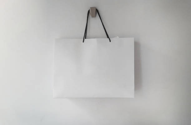 White paper shopping bag hanging on the wall