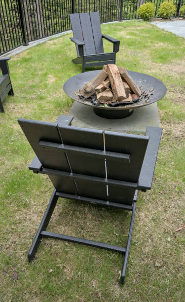 istock fire ring burning pit with chairs (outdoor firewood burn) campfire unlit country home camping recreation outdoors cooking outside sitting around fire chairs leisure yard back patio 2159356233