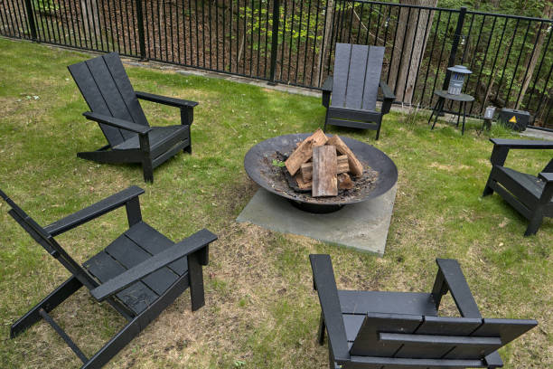 istock fire ring burning pit with chairs (outdoor firewood burn) campfire unlit country home camping recreation outdoors cooking outside sitting around fire chairs leisure yard back patio 2159356294