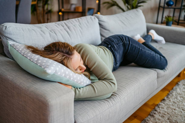 istock Young Woman Sleeping On The Sofa At Home 2159357213
