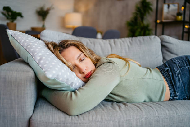 istock Young Woman Sleeping On The Sofa At Home 2159357235