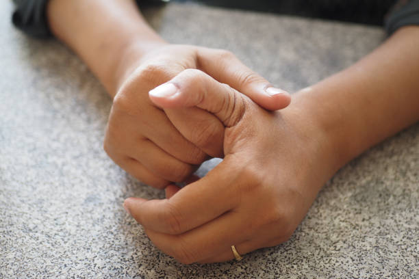 istock Young women hands suffering wrist pain, 2159357424