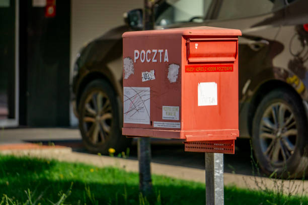 Ostrow Wielkopolski in the Greater Poland Voivodeship, Poland - June 26, 2024 red mailbox for the post office standing in the city center