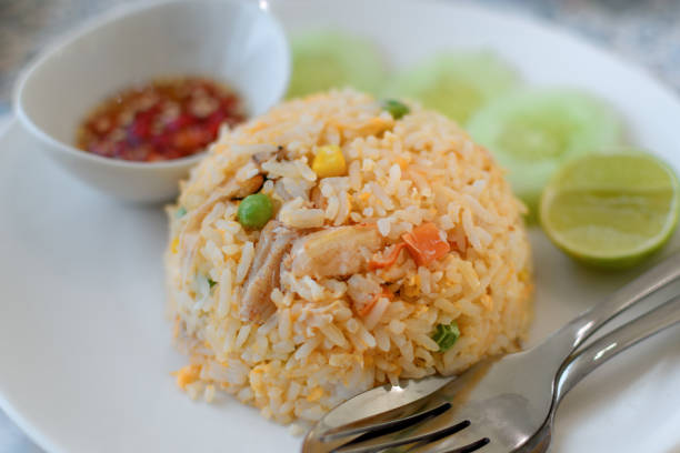 Grilled chicken breast with rice and vegetable. Healthy lunch. Isolated on white