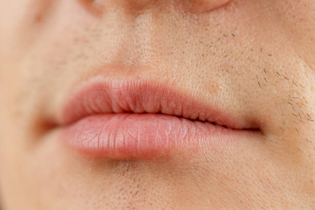 istock Human lips selective focus Anatomy of the structure male face close-up 2159363616
