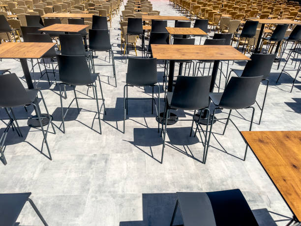 istock Large group of empty outdoor tables and chairs 2159364852