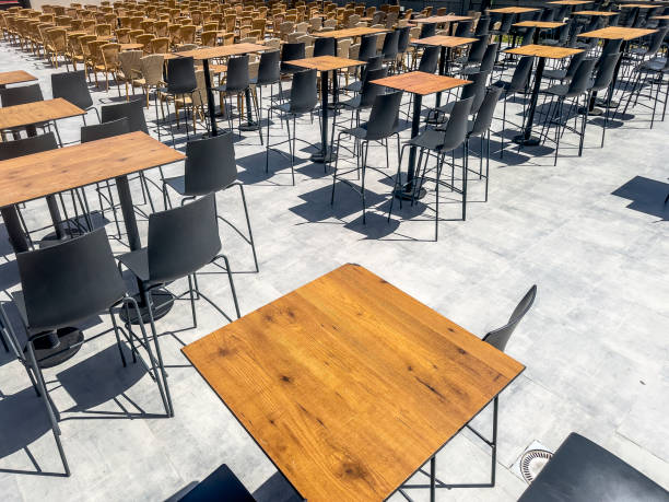 istock Large group of empty outdoor tables and chairs 2159364880