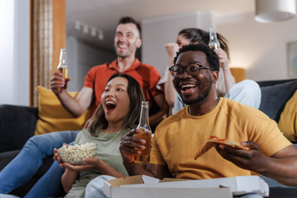 istock Friends enjoying time together and watching sport 2159365084