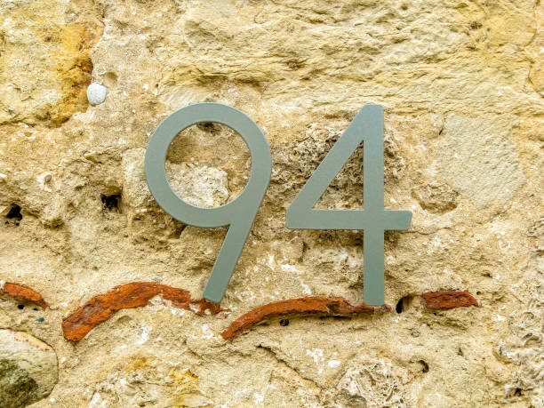istock Building number on old house exterior wall 2159365685
