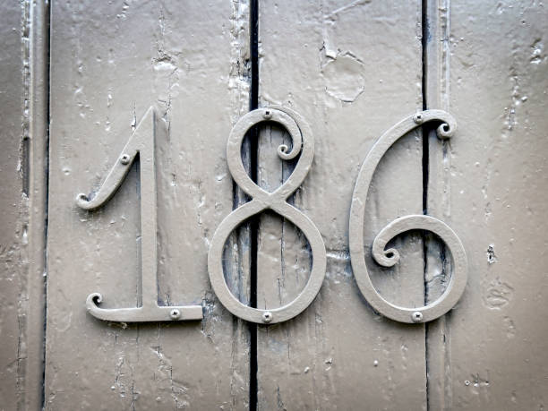 Building number on house wooden front door