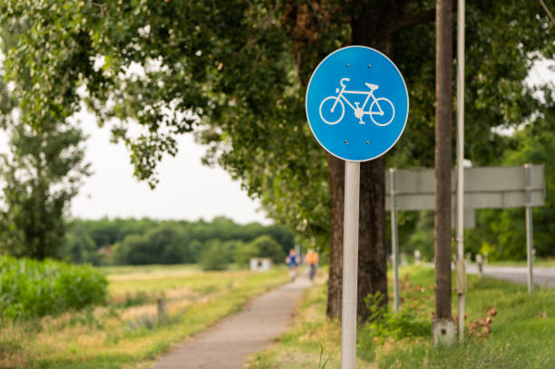 istock Bicycle lane traffic sign with cyclists 2159369144