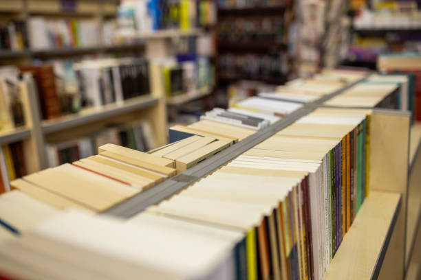 Interior of a modern bookstore with variety of books stacked on book shelves all around.