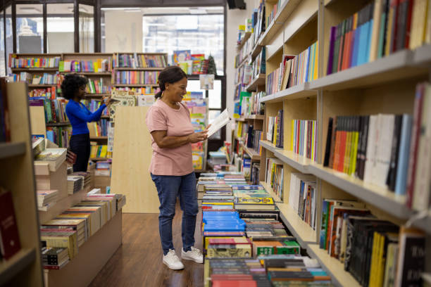 istock Woman browsing to buy a book 2159370608