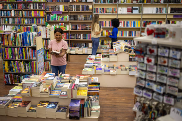 istock Woman browsing to buy a book 2159370828