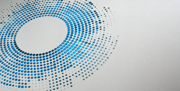 istock Modern circular paper cutout art with a gradient pattern of blue dots transitioning from light to dark 2159373371