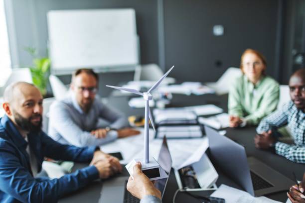 istock Business meeting on sustainable energy resources: windmills 2159374250
