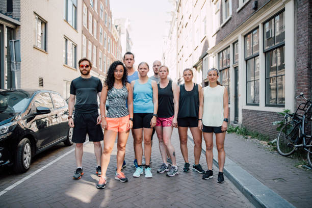 Group of runners training in the city streets in Amsterdam.