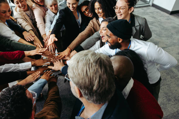 istock Diverse team showing teamwork and collaboration with hands in during corporate meeting 2159375530