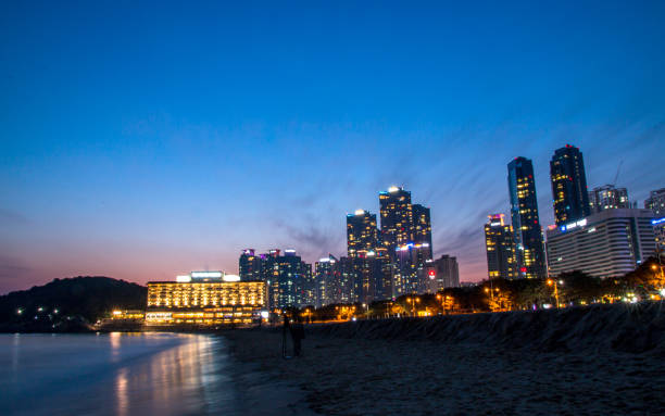 Landscape night view of Haeundae beach in Busan, South Korea.
