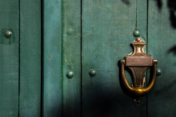 istock wooden doors with an old metal door handle knocker 2159378941