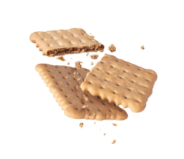 istock Crushed crispy cookies in the air close up isolated on white background 2159383410
