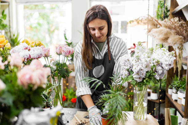 istock Florist Prepares Soil for Beautiful Arrangements 2159383727