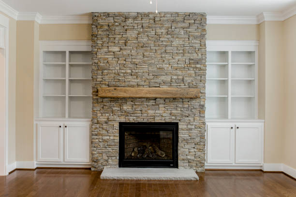 istock Spacious Living Room with Stone Fireplace and Large Windows Providing Light, Built in Shelves 2159385857