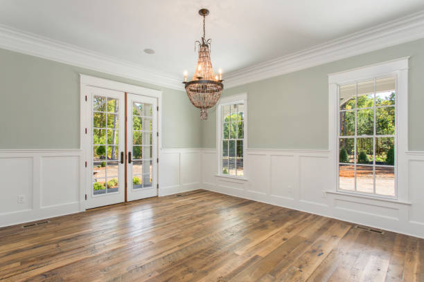 Bright Dining Room with Double Doors, Chandelier, and Natural Light Coming In