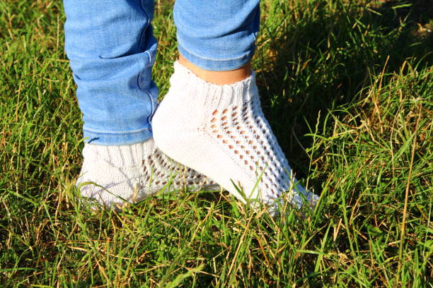 istock A person's feet in the grass 2159387254