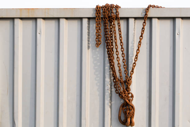 Close-up of a heavy rusty chain on a container