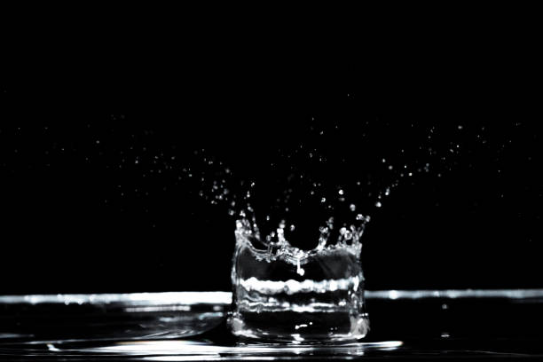 istock abstract macro shot of splashing water drops 2159396666
