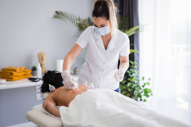 istock Therapist cleaning after hijama therapy 2159398528
