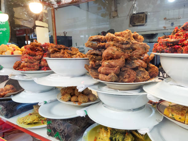istock Padang restaurant front display fresh cooked food from behind the glass window 2159398746
