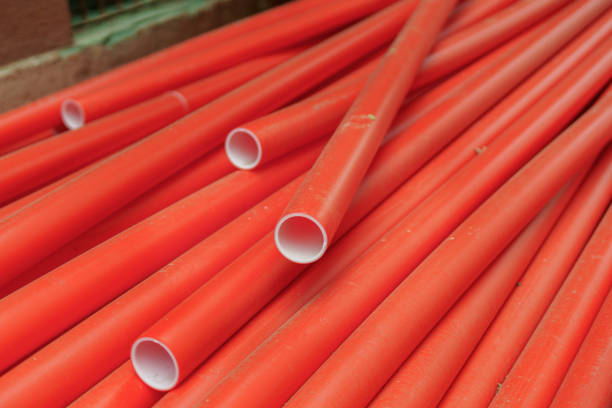 istock Many medium-sized red plastic pipes, symbolizing industrial construction, infrastructure, and vibrant color in modern engineering projects 2159400008