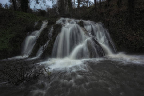 front view of the Tubilla del Agua waterfall in Burgos on a cold winter day