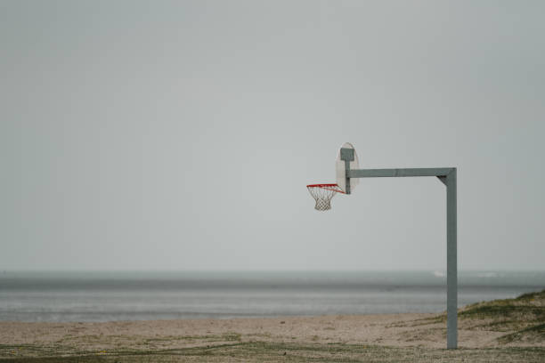 istock minimalist basketball hoop on a beach 2159402874