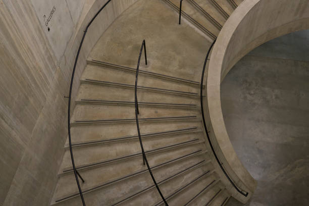 Spiral staircase in a modern building with concrete walls