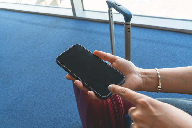 istock Woman hands holding and using smartphone with blank screen 2159414929