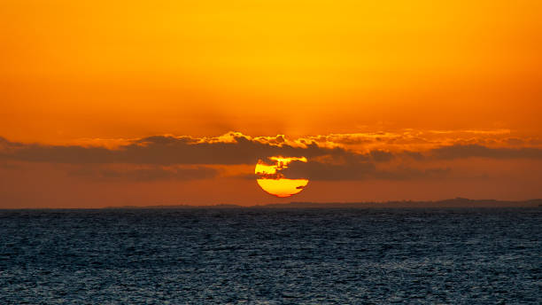 istock Beautiful dramatic and relaxing yellow and orange sunset with colorful clouds. 2159415659