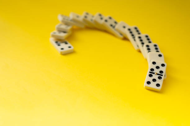 istock Dominoes on a yellow background. 2159415662